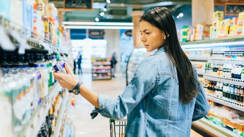 woman looking at can